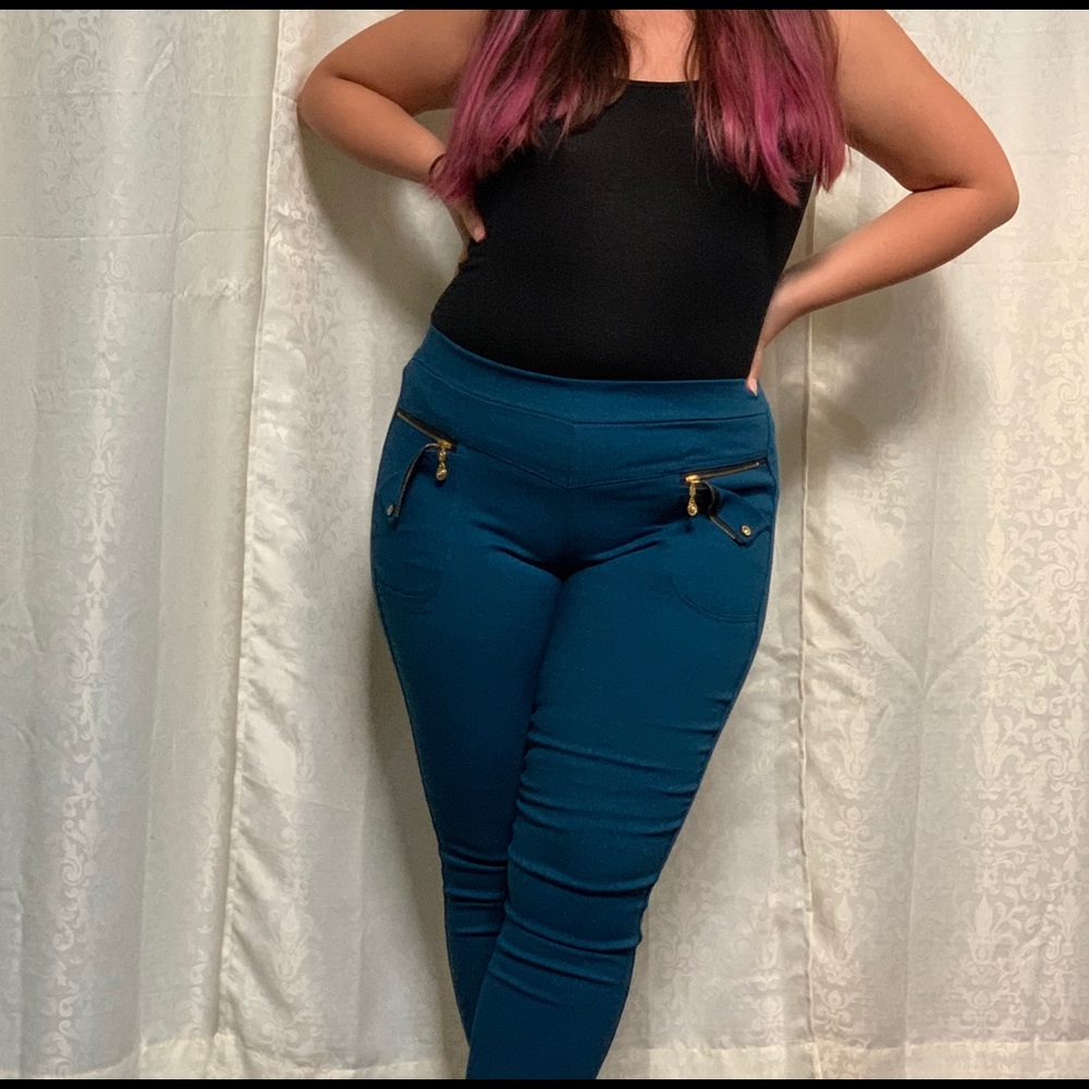 Teal skinny jean jeggings with gold zippers